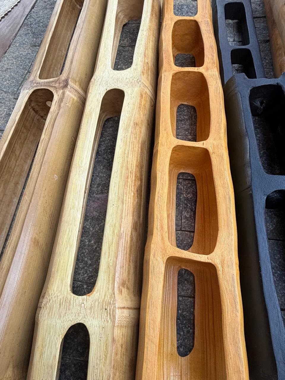 Carved bamboo cores, each from a different culm