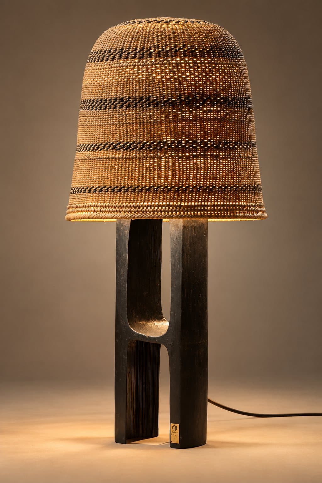 Alma medium lamp with black base, photographed in the studio