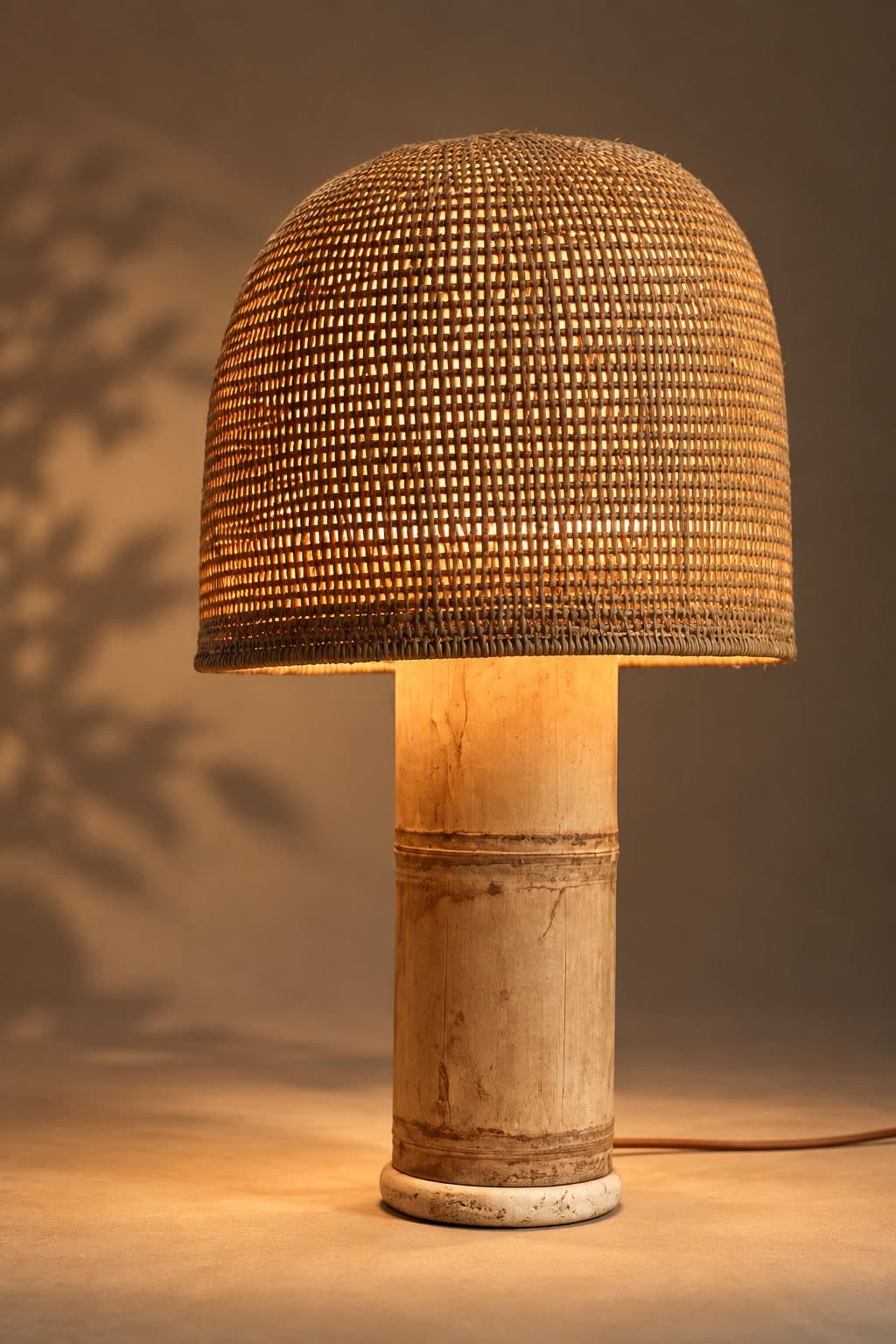 Whole bamboo lamp with stone base, photographed in the studio